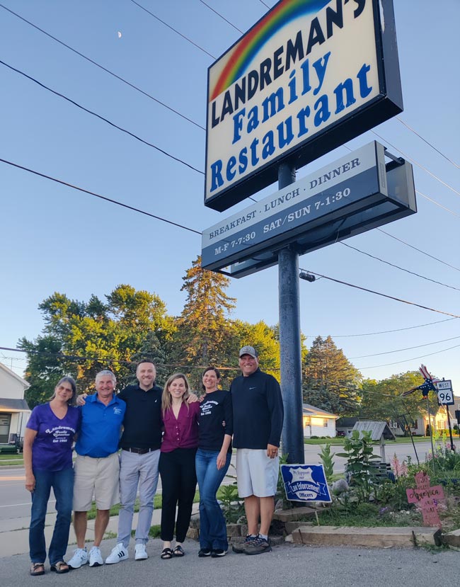 The new owners and previous owners stand out front of Landreman's Family Restaurant which is now named Sweetberry's Family Restaurant